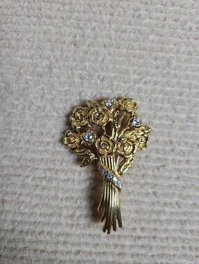 Monet gold-toned floral bouquet brooch with Cubic Zirconia Accents